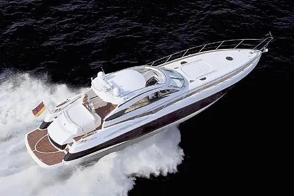 Slide: The Image of 2003 Sunseeker Predator 61 yacht cruising on open water, showcasing sleek design and luxury. - 8