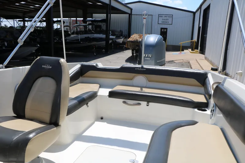 Slide: The Image of Interior of a 2018 Stingray 182 SC boat with seating. - 28