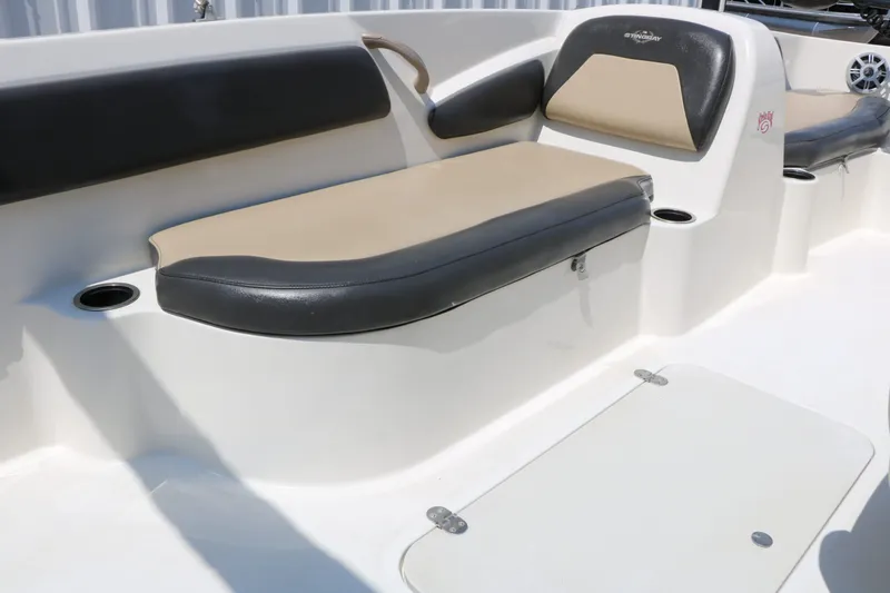 Slide: The Image of Interior view of 2018 Stingray 182 SC boat with seating area. - 34