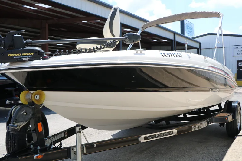 Slide: The Image of 2018 Stingray 182 SC boat on trailer at Texas Boat World. - 4