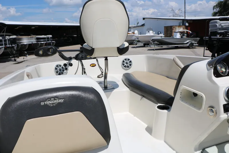 Slide: The Image of Interior of a 2018 Stingray 182 SC boat with seating. - 40
