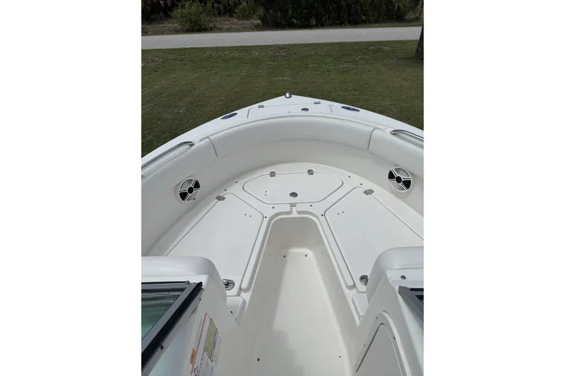 Slide: The Image of 2010 Robalo R227 Dual Console boat interior, featuring spacious seating and storage compartments. - 10