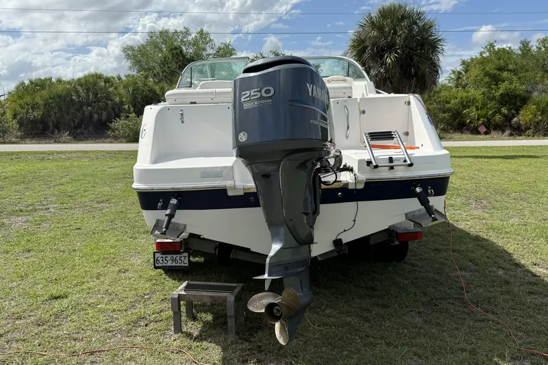 Slide: The Image of 2010 Robalo R227 Dual Console boat with Yamaha 250 engine on grassy area. - 3