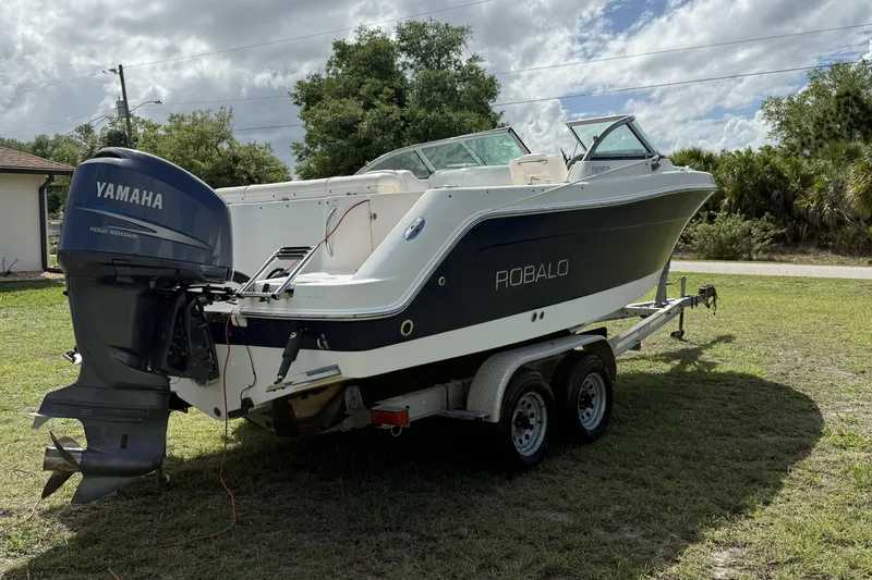 Slide: The Image of 2010 Robalo R227 Dual Console boat on trailer with Yamaha outboard motor. - 4