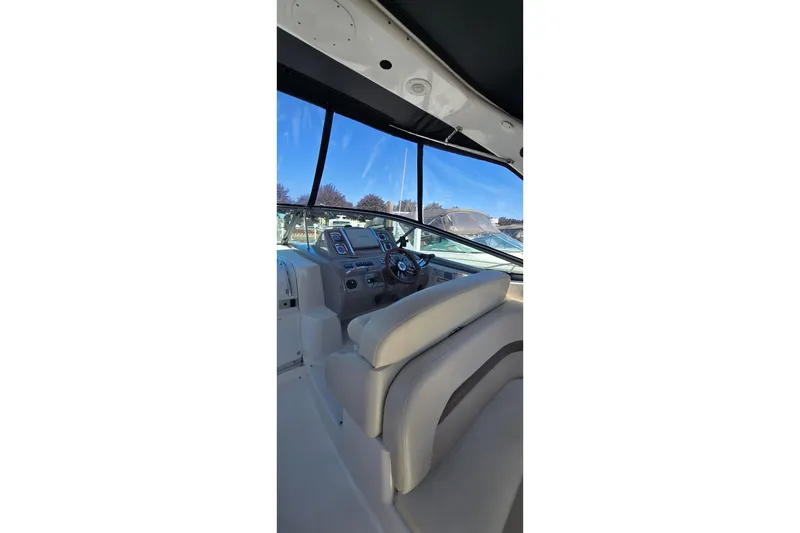Slide: The Image of 2009 Chaparral Signature 310 boat interior with steering wheel and dashboard view. - 10