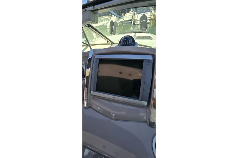 Slide: The Image of Dashboard of 2009 Chaparral Signature 310 with Garmin navigation system. - 12
