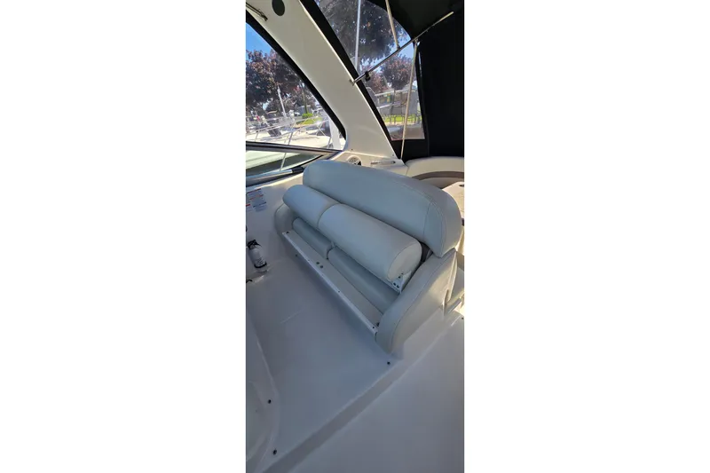 Slide: The Image of 2009 Chaparral Signature 310 boat interior with white seating and window view. - 15