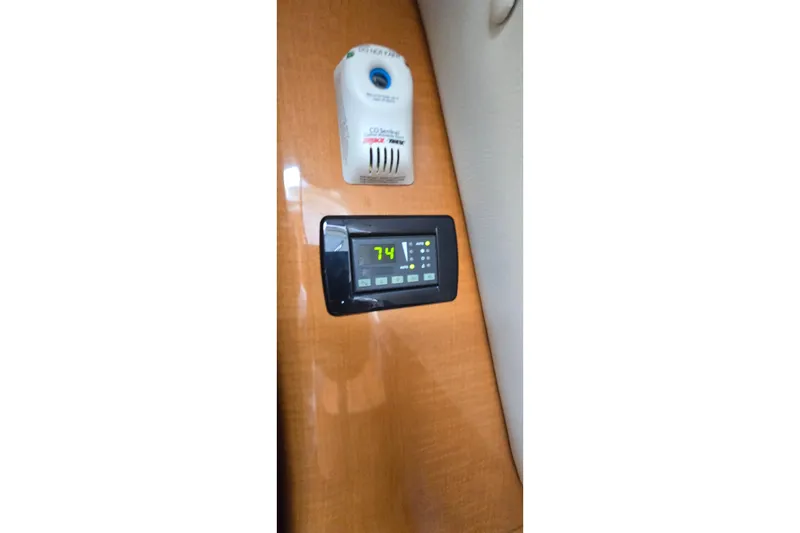 Slide: The Image of Digital thermostat and CO detector in 2009 Chaparral Signature 310 boat interior. - 29