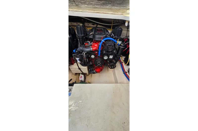 Slide: The Image of Engine compartment of a 2009 Chaparral Signature 310 boat, showcasing mechanical components. - 33