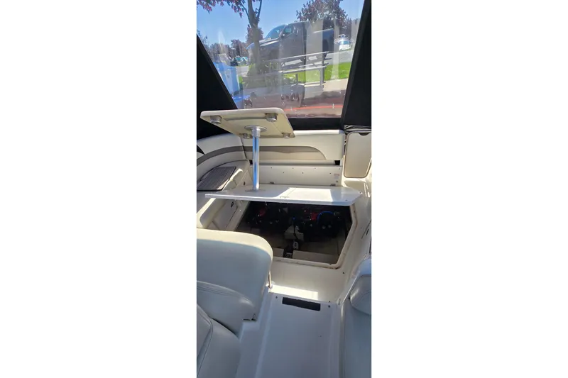 Slide: The Image of Interior view of 2009 Chaparral Signature 310 boat with seating and table setup. - 35