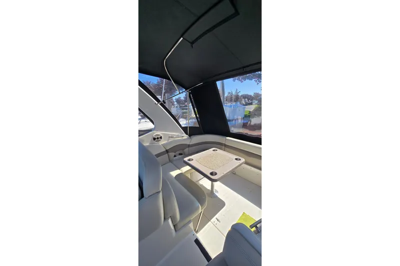 Slide: The Image of 2009 Chaparral Signature 310 boat interior with seating and table. - 5