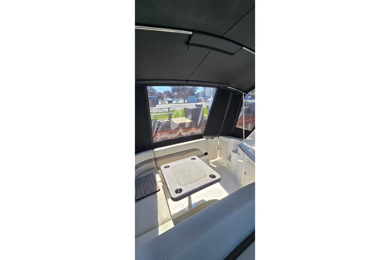 Slide: The Image of Interior view of 2009 Chaparral Signature 310 boat with seating and table. - 6
