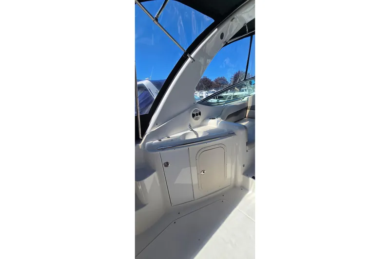 Slide: The Image of 2009 Chaparral Signature 310 boat interior with sink and storage cabinet. - 7