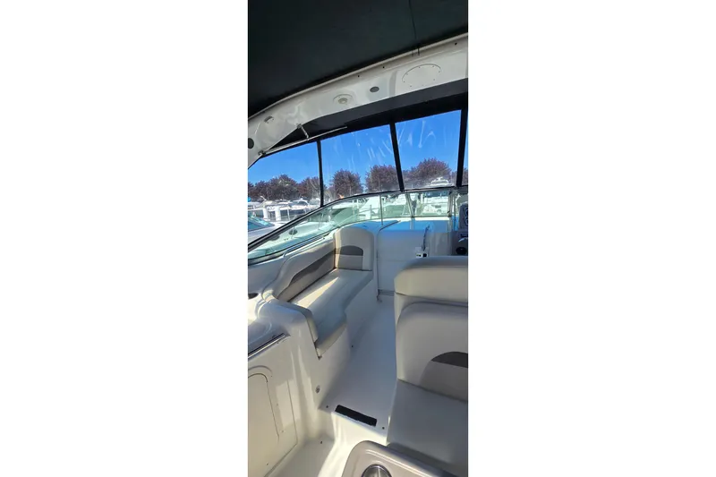 Slide: The Image of Interior view of 2009 Chaparral Signature 310 boat with seating and windows. - 9
