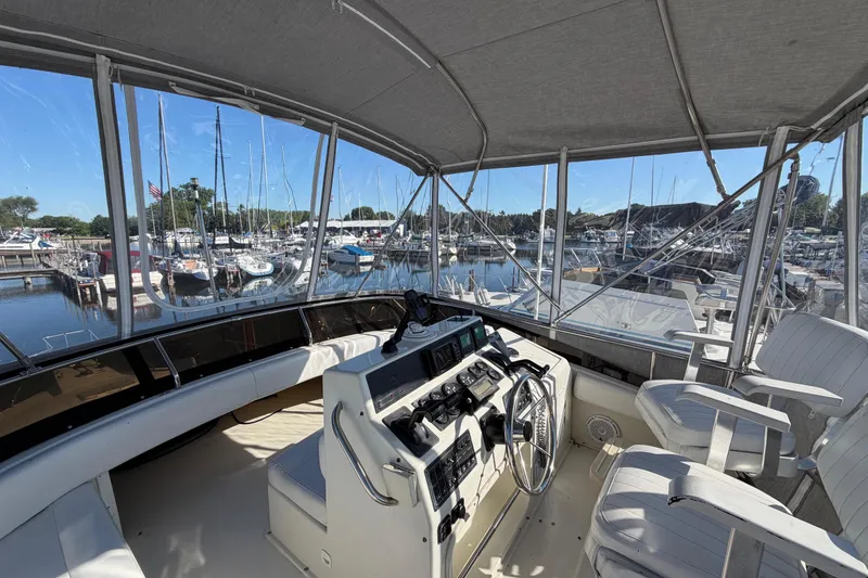 Slide: The Image of Interior view of a 1995 Silverton 37 Convertible yacht at a marina. - 13