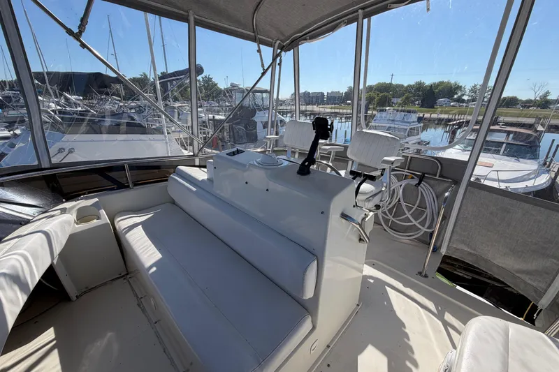 Slide: The Image of Interior view of 1995 Silverton 37 Convertible yacht at marina. - 17