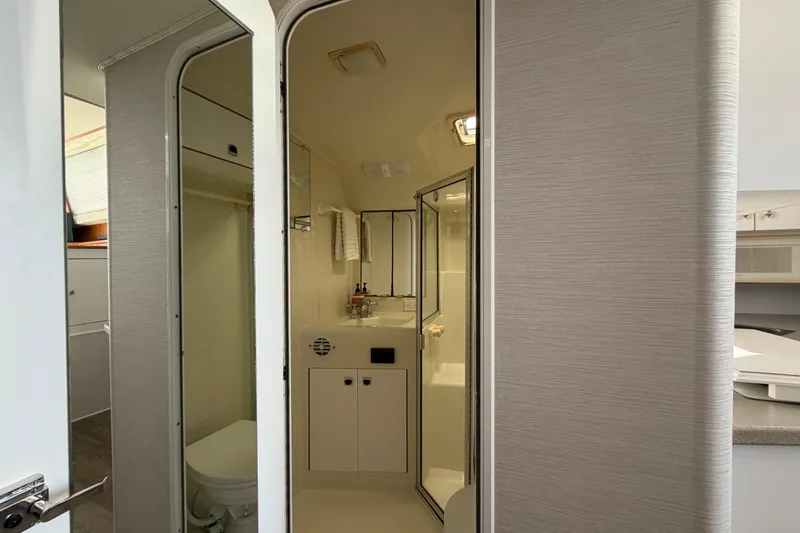 Slide: The Image of Interior view of 1995 Silverton 37 Convertible yacht bathroom with shower and sink. - 32