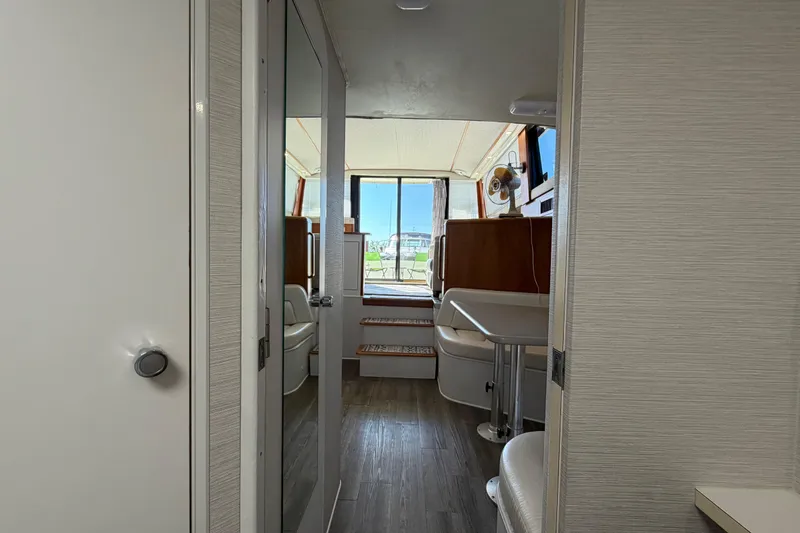 Slide: The Image of Interior view of 1995 Silverton 37 Convertible yacht, featuring modern furnishings and natural light. - 40