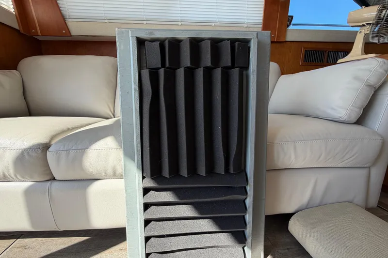 Slide: The Image of Interior of 1995 Silverton 37 Convertible with acoustic foam panel and white leather seating. - 43