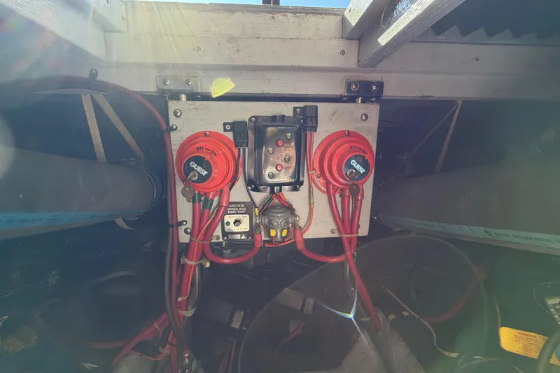 Slide: The Image of Electrical panel of a 1995 Silverton 37 Convertible boat with wiring and switches. - 44