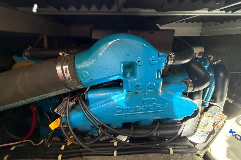 Slide: The Image of Engine compartment of a 1995 Silverton 37 Convertible boat with Crusader engine. - 48