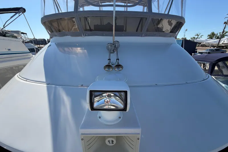 Slide: The Image of 1995 Silverton 37 Convertible yacht with spotlight and enclosed bridge. - 6