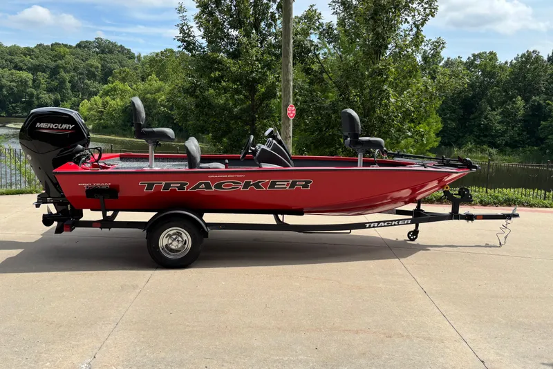 The Image of 2026 Tracker Pro Team 175 Crappie Edition boat on trailer, parked outdoors. - 0