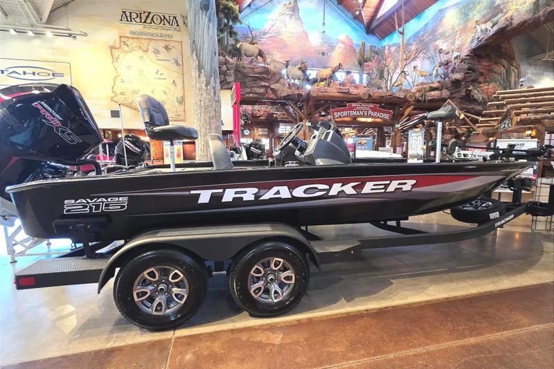 The Image of 2026 Tracker Savage 215 boat displayed indoors, featuring sleek design and modern features. - 0