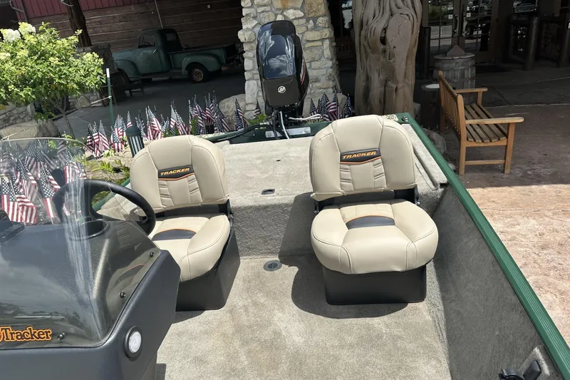 Slide: The Image of 2026 Tracker Bass Tracker Classic Limited boat interior with two beige seats. - 9