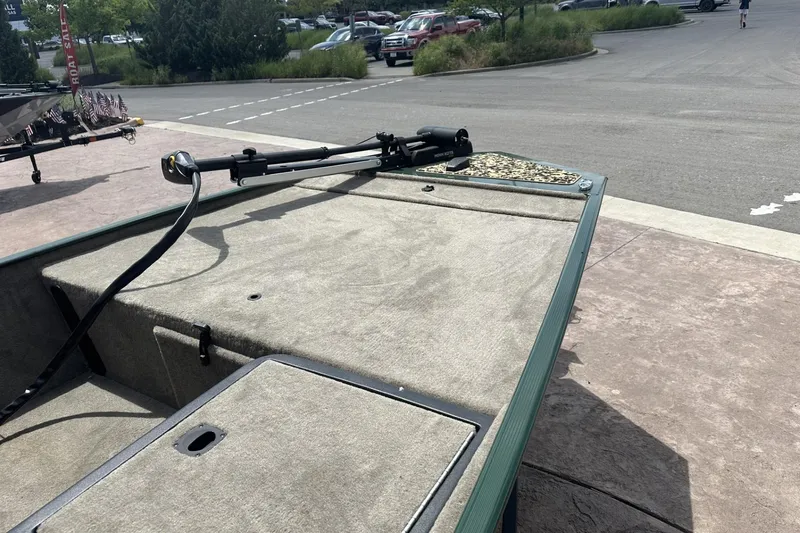 Slide: The Image of 2026 Tracker Bass Tracker Classic Limited boat on display at a dealership. - 11