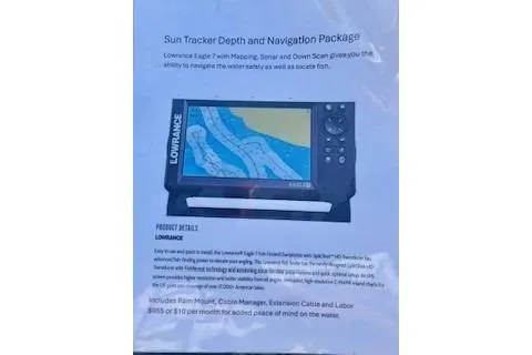 Slide: The Image of Sun Tracker Party Barge 16 DLX 2026 with Lowrance navigation system display and features. - 4