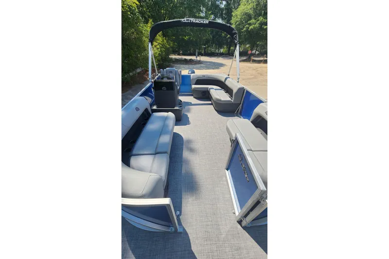 Slide: The Image of 2026 Sun Tracker Party Barge 16 DLX pontoon boat with spacious seating and canopy. - 4