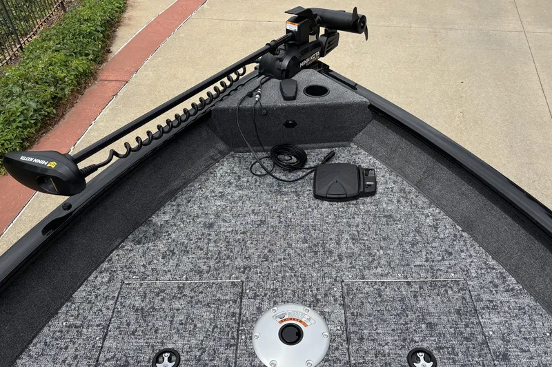 Slide: The Image of 2026 Tracker Pro Guide V-16 SC boat deck with Minn Kota trolling motor. - 3