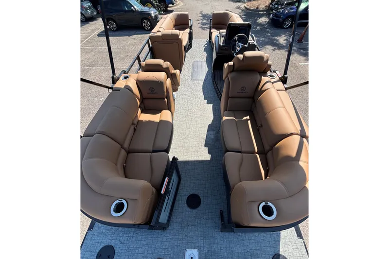 Slide: The Image of 2026 Regency 230 DL pontoon boat with luxurious tan seating and modern design. - 1