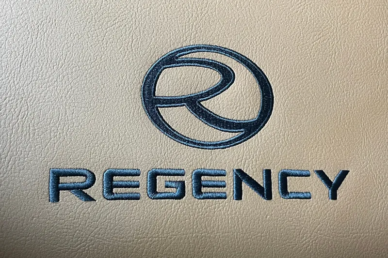 Slide: The Image of Regency logo on beige leather, 2026 Regency 230 DL model branding. - 14