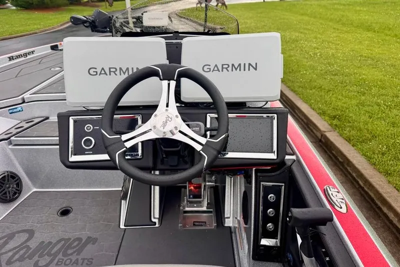 Slide: The Image of 2026 Ranger Z521R Cup-Equipped boat dashboard with Garmin displays and steering wheel. - 34
