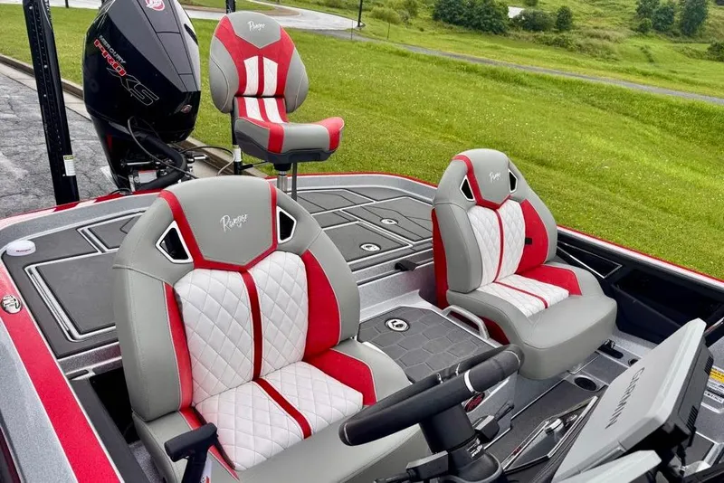 Slide: The Image of 2026 Ranger Z521R Cup-Equipped boat with stylish red and white seating, outdoor setting. - 30
