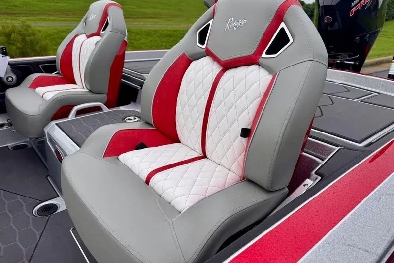 Slide: The Image of 2026 Ranger Z521R Cup-Equipped boat seats with red and white quilted design. - 38