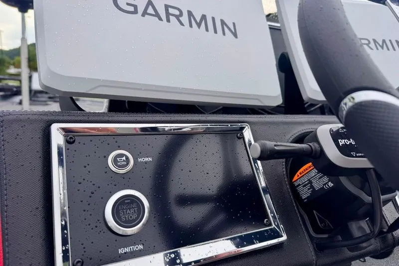 Slide: The Image of 2026 Ranger Z521R Cup-Equipped boat dashboard with Garmin displays and ignition controls. - 41