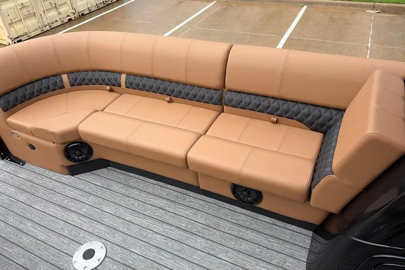 Slide: The Image of Luxurious tan seating on 2026 Ranger 220FC boat, featuring quilted accents and integrated speakers. - 10