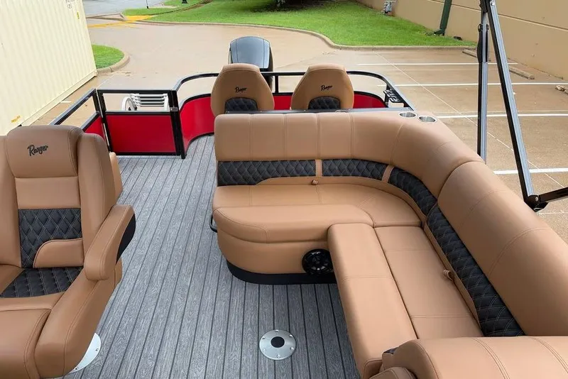 Slide: The Image of Luxurious interior of 2026 Ranger 220FC boat with tan and black seating. - 6