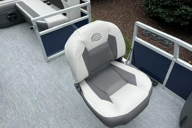 Slide: The Image of 2026 Sun Tracker Bass Buggy 18 DLX boat seat with gray and white upholstery. - 8