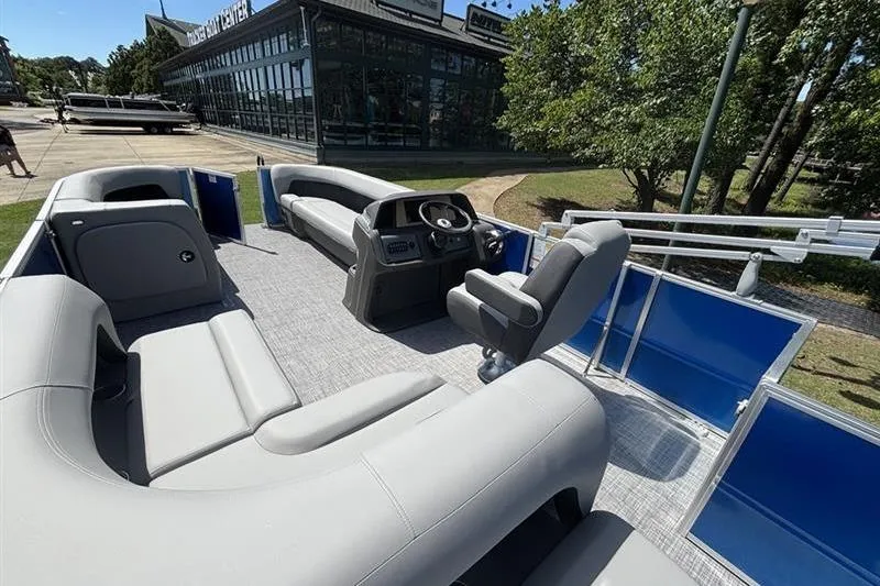 Slide: The Image of 2026 Sun Tracker Party Barge 18 DLX pontoon boat with spacious seating and modern helm. - 8