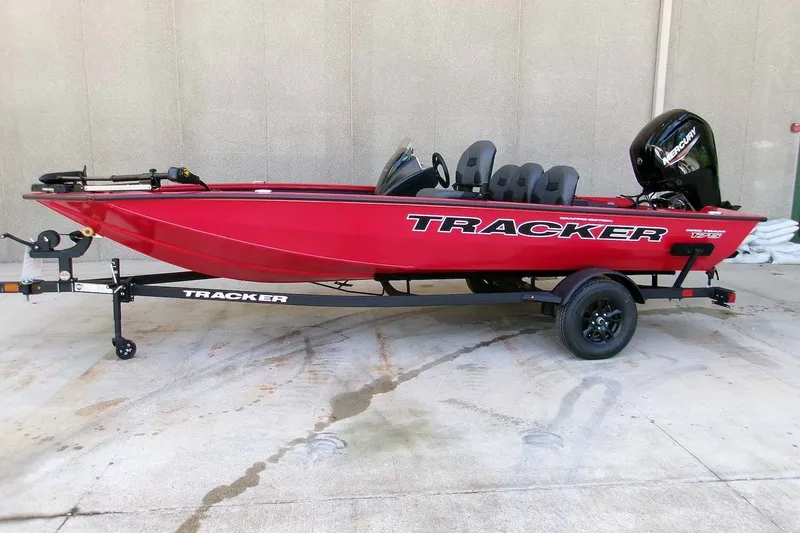 The Image of 2026 Tracker Pro Team 175 Crappie Edition boat, red, on trailer, side view. - 0