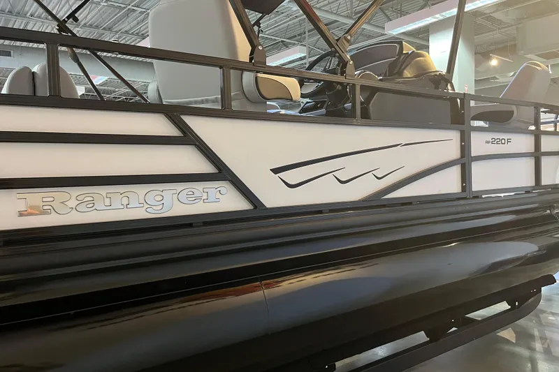 Slide: The Image of 2026 Ranger 220F pontoon boat, sleek design with modern seating and stylish detailing. - 4