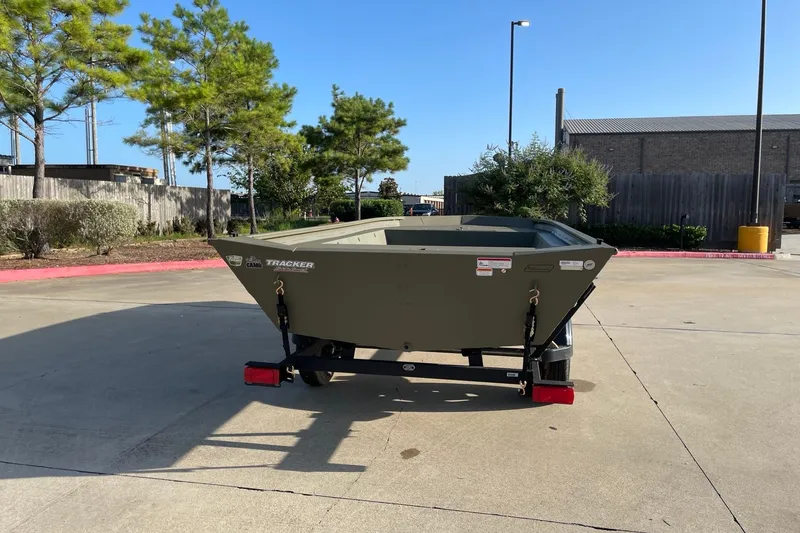 Slide: The Image of 2026 Tracker Grizzly 1754 Utility boat on trailer in parking lot. - 4