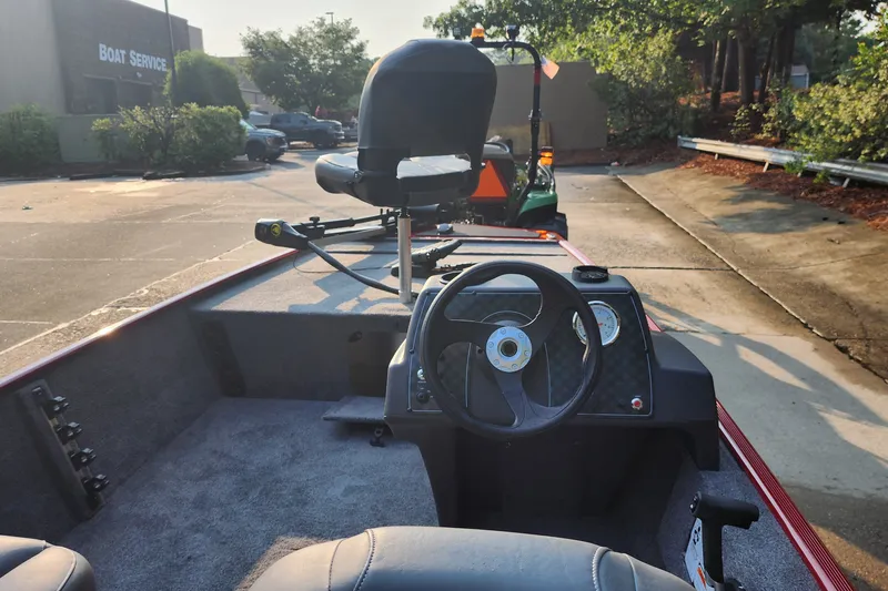 Slide: The Image of 2026 Tracker Bass Tracker Classic XL boat interior with steering wheel and seating. - 27