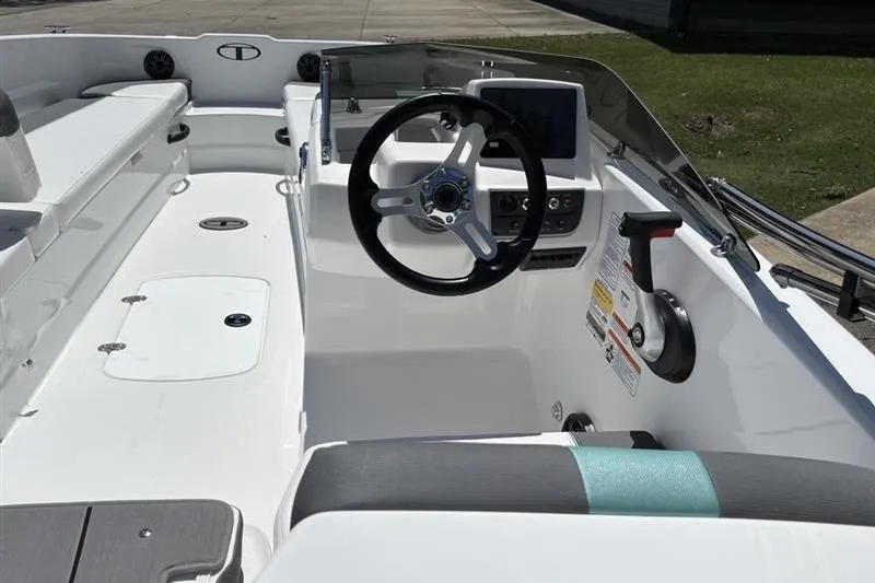 Slide: The Image of 2026 Tahoe T18 boat interior with steering wheel and dashboard, showcasing modern design. - 11
