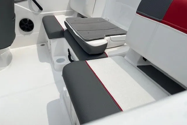 Slide: The Image of 2026 Tahoe T21 boat interior with gray and red cushioned seating. - 12