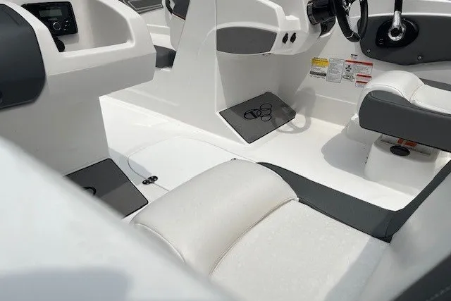 Slide: The Image of Interior of 2026 Tahoe T21 boat with white and gray seating and dashboard. - 9